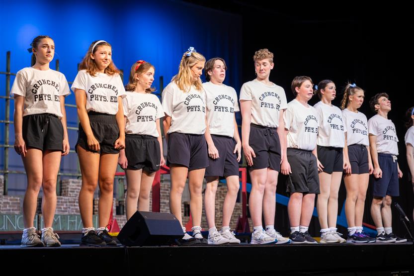 Students perform onstage